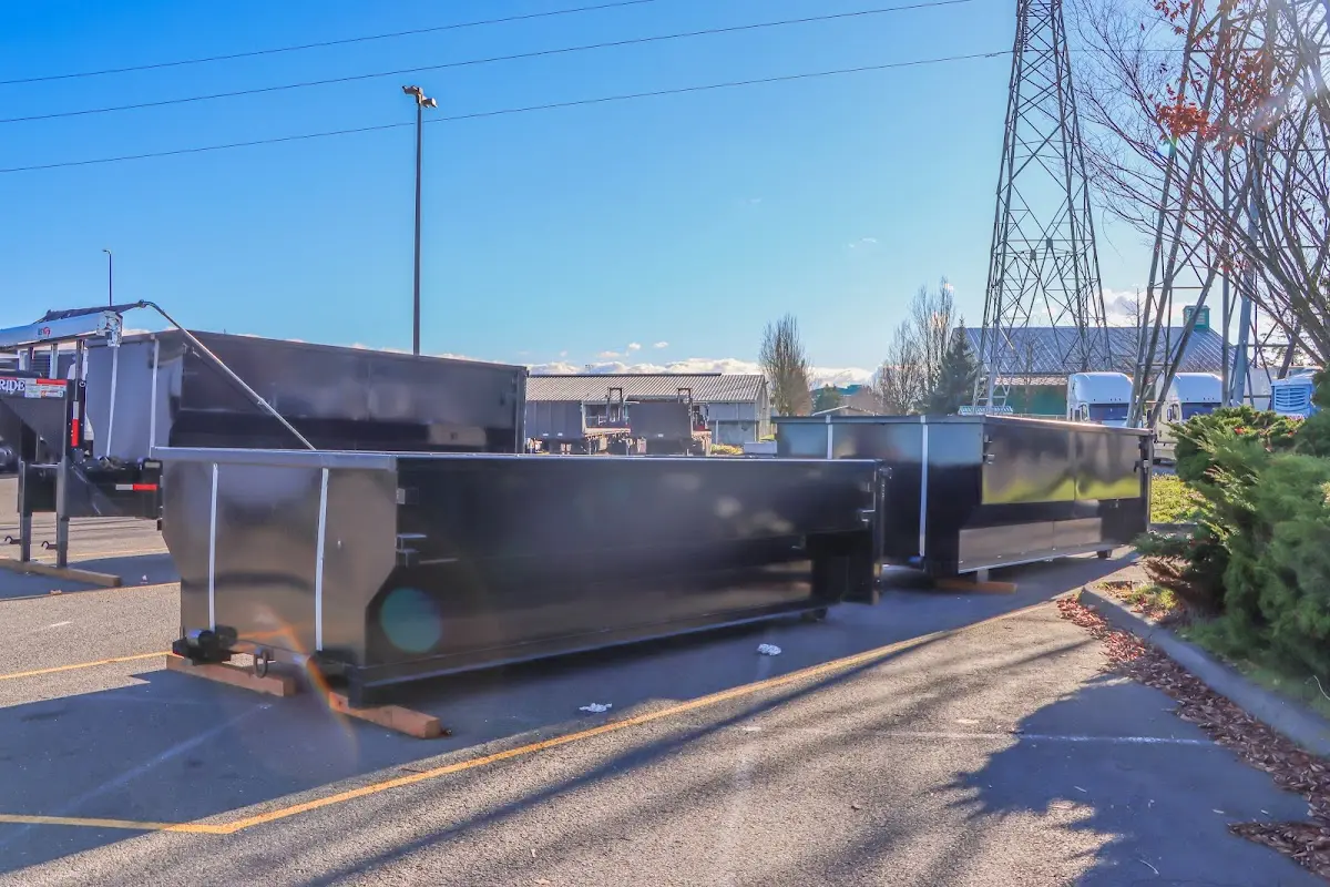 Roll-off dumpster ready for waste disposal at job site for Demolition Dumpster Rental in New London